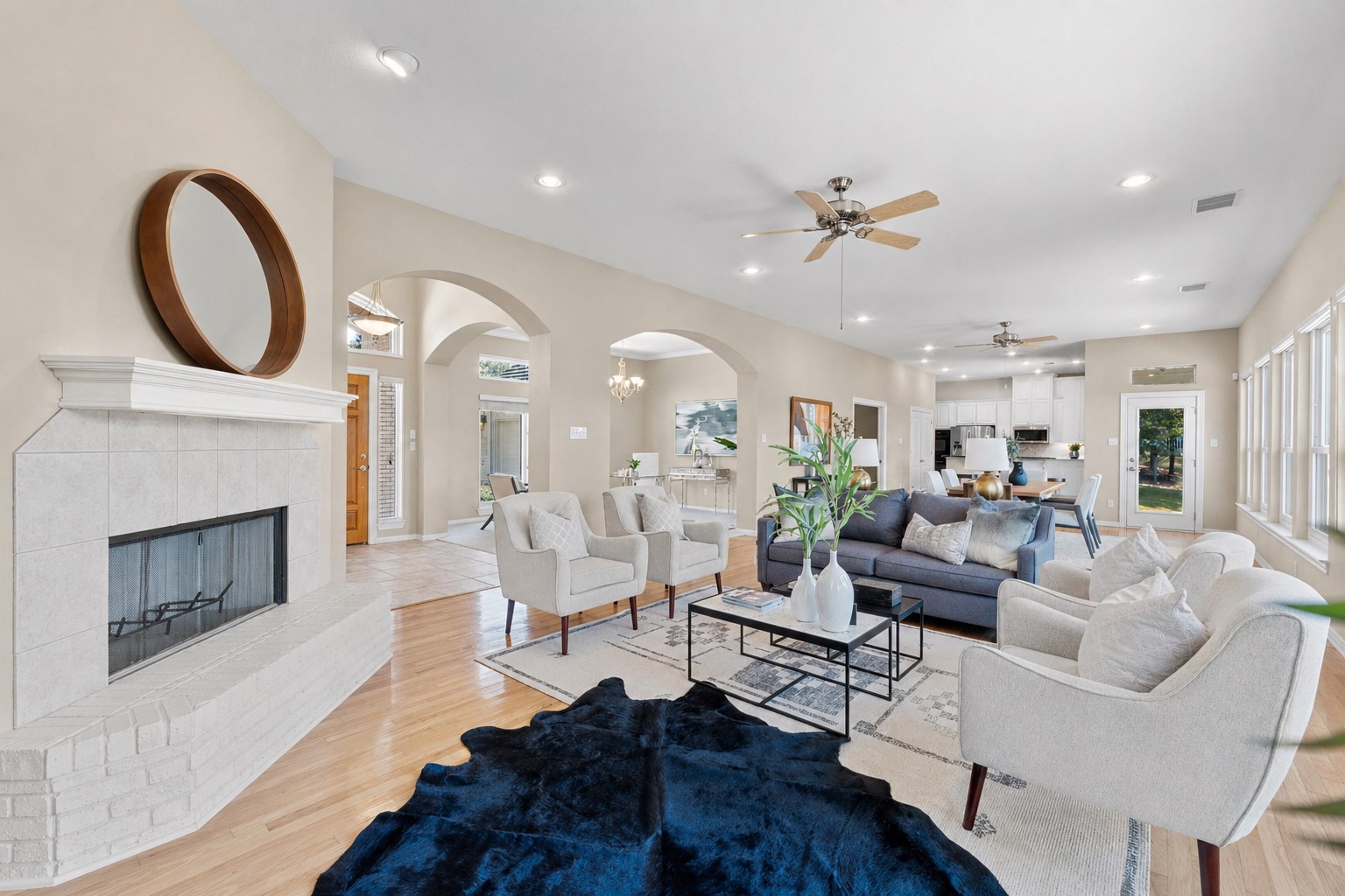 209 Overlook Court Georgetown, TX 78628 - Photo 8 of 34 a living room with furniture a fireplace and a ceiling fan