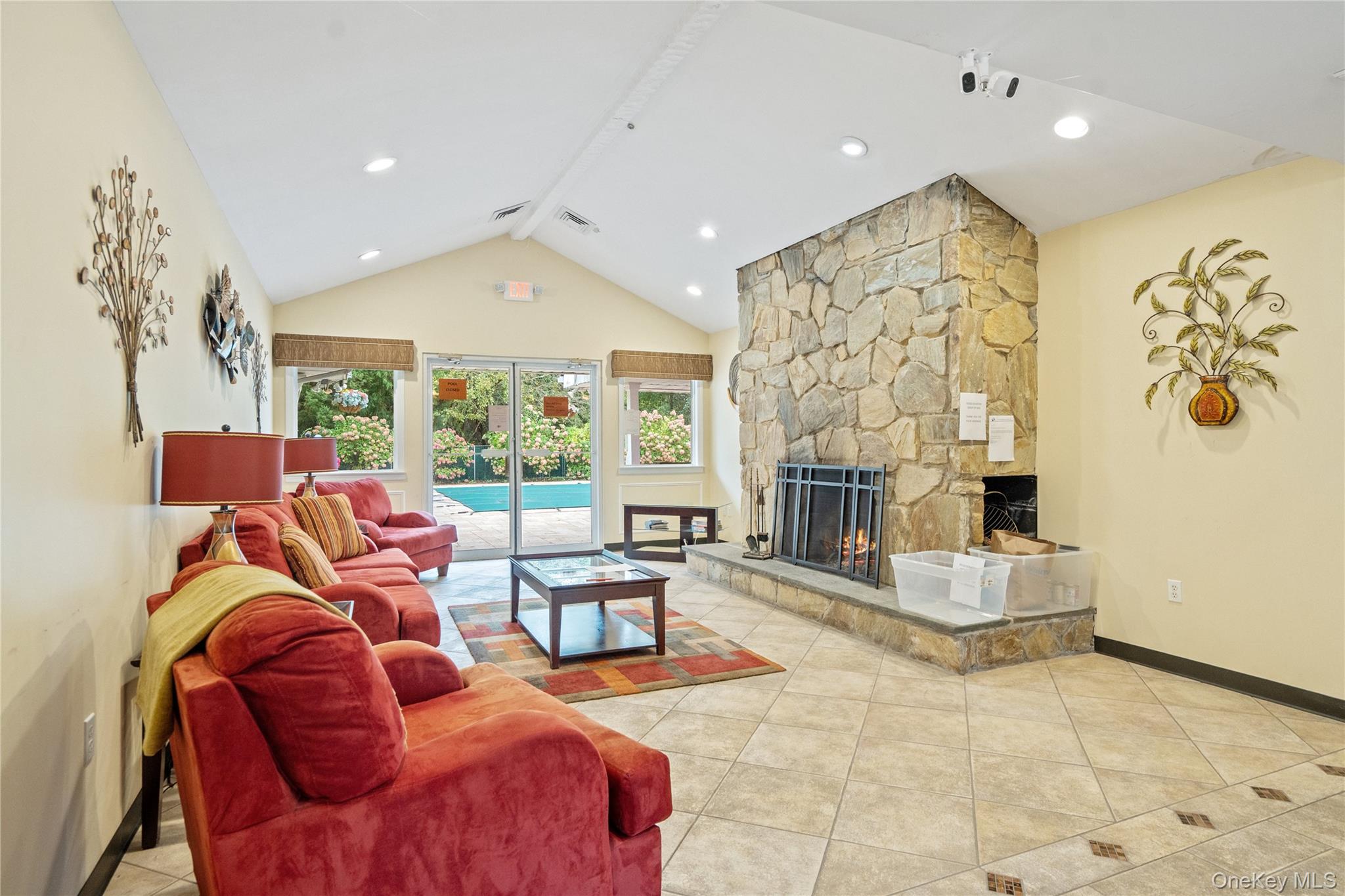 55 Forge Lane Coram, NY 11784 - Photo 27 of 28 a living room with fireplace furniture and a large window