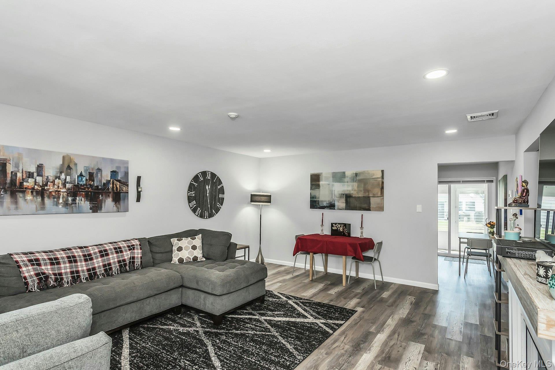 55 Forge Lane Coram, NY 11784 - Photo 3 of 28 a living room with furniture and rug