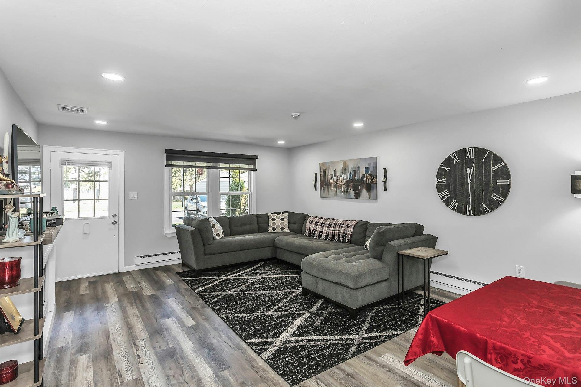 55 Forge Lane Coram, NY 11784 - Photo 4 of 28 a living room with furniture and a window