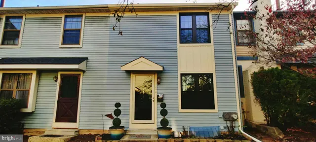 a view of a house with brick walls