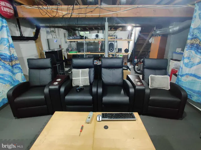 a living room with furniture and a lamp