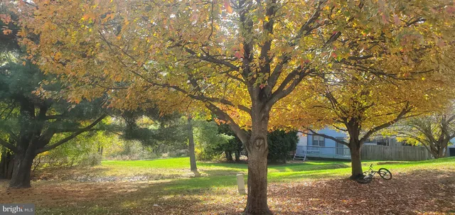 a view of a dining room with furniture and window