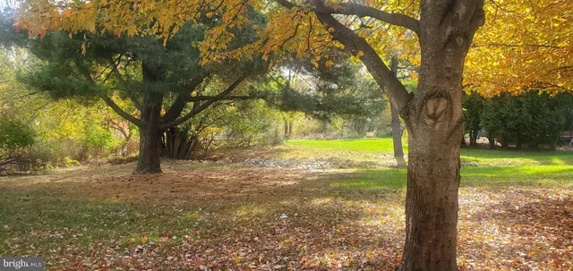 a kitchen with stainless steel appliances a stove microwave and refrigerator