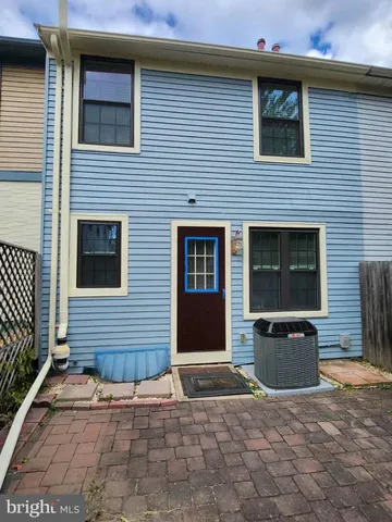 a front view of a house with stairs