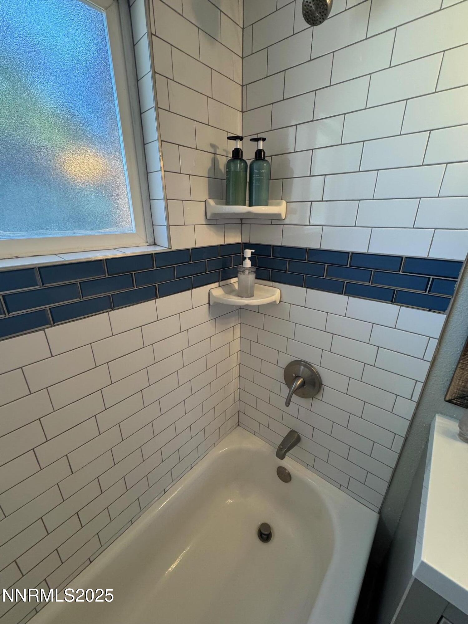 565 Denslowe Drive Reno, NV 89512 - Photo 13 of 26 a bathroom with a sink and vanity