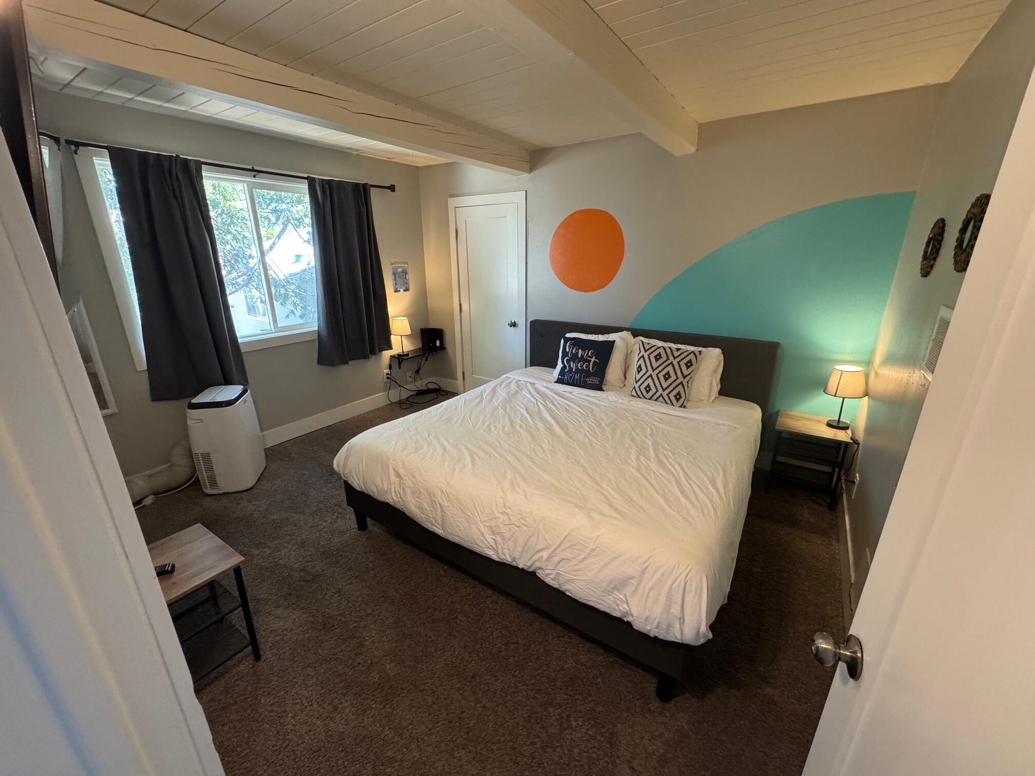 565 Denslowe Drive Reno, NV 89512 - Photo 17 of 26 a bedroom with a bed and dresser with mirror