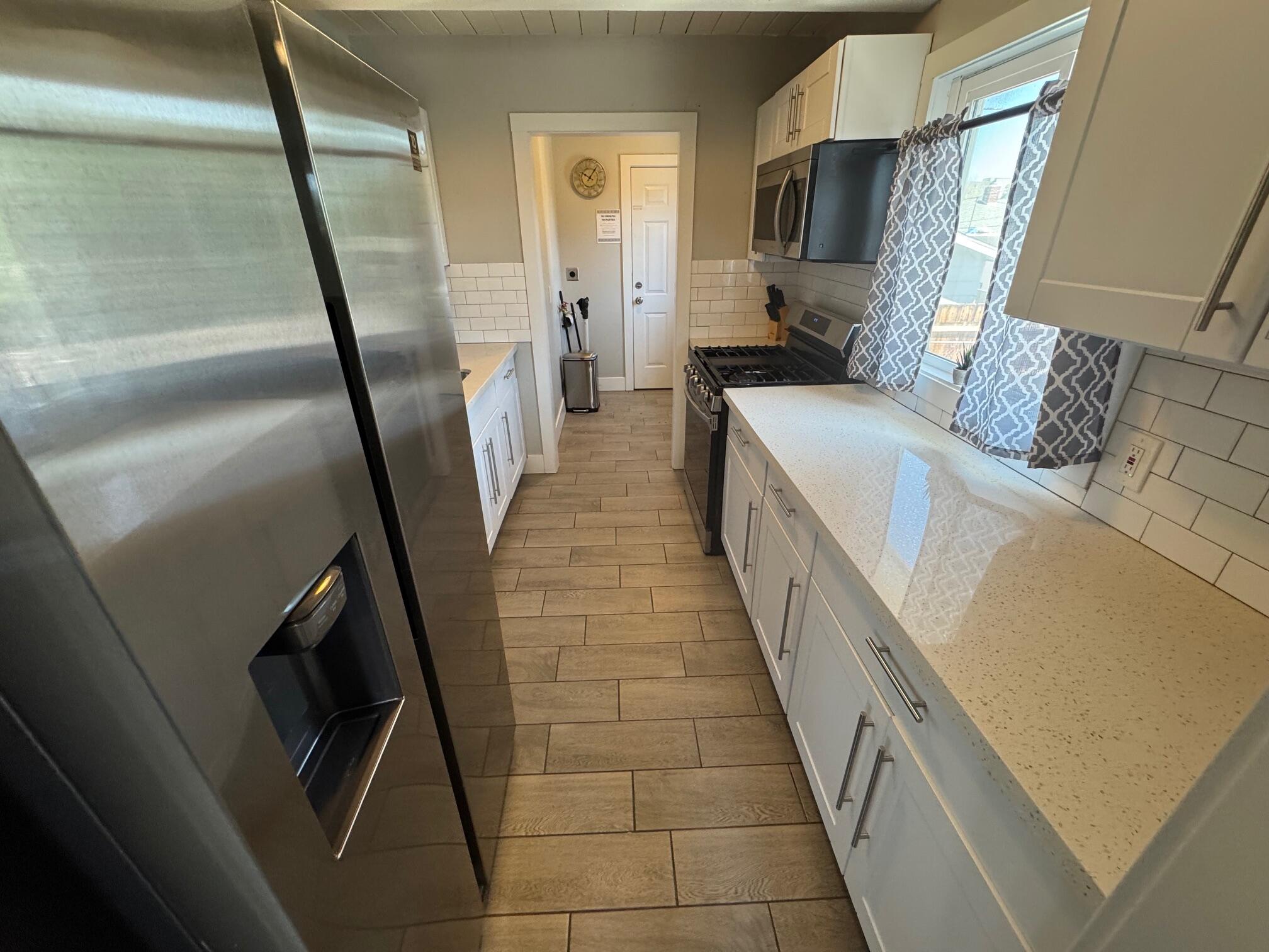 565 Denslowe Drive Reno, NV 89512 - Photo 20 of 26 a hallway with a washer and dryer