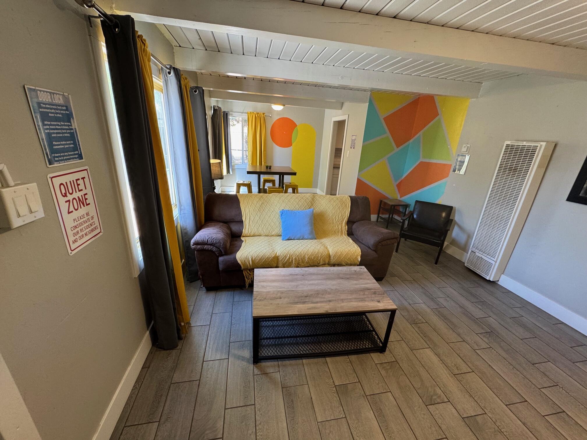 565 Denslowe Drive Reno, NV 89512 - Photo 2 of 26 a bedroom with furniture and a large window