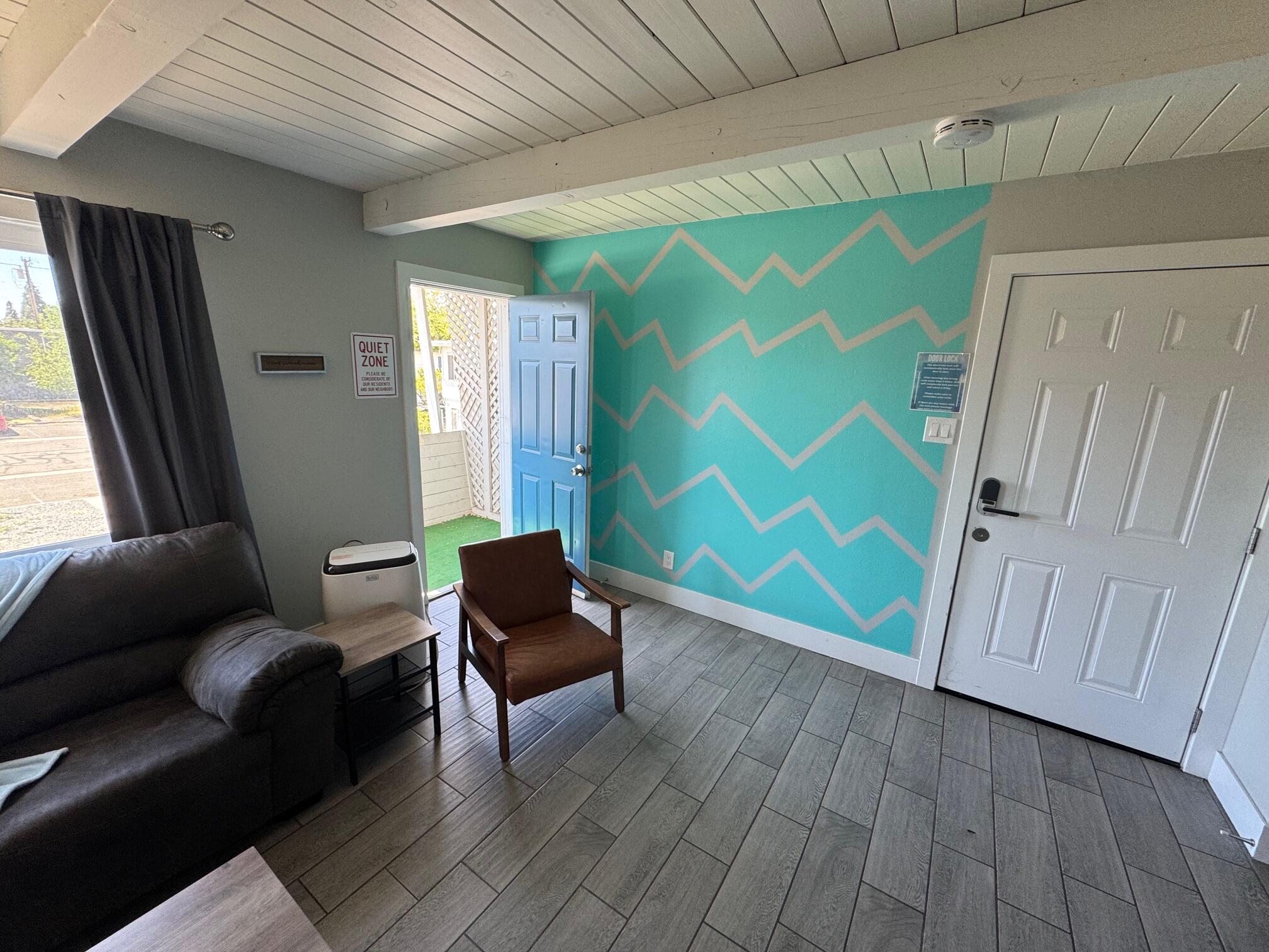 565 Denslowe Drive Reno, NV 89512 - Photo 24 of 26 a living room with furniture and a wooden floor