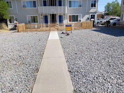 565 Denslowe Drive Reno, NV 89512 - Photo 25 of 26 a front view of a house with a yard