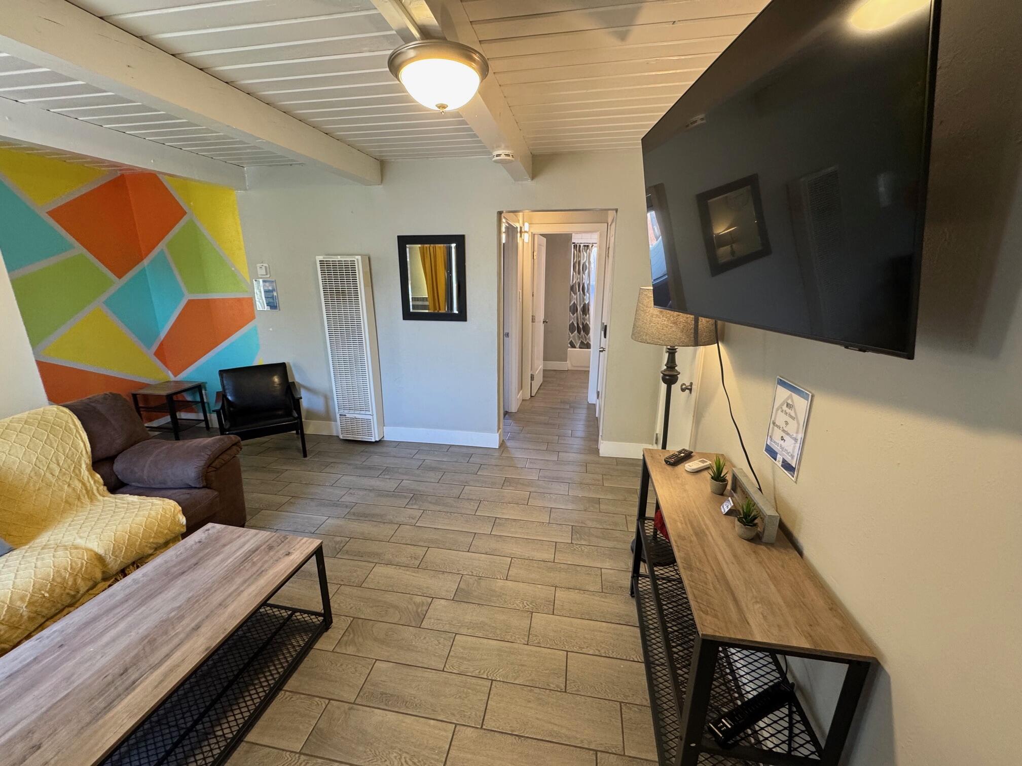 565 Denslowe Drive Reno, NV 89512 - Photo 3 of 26 a living room with furniture and a flat screen tv