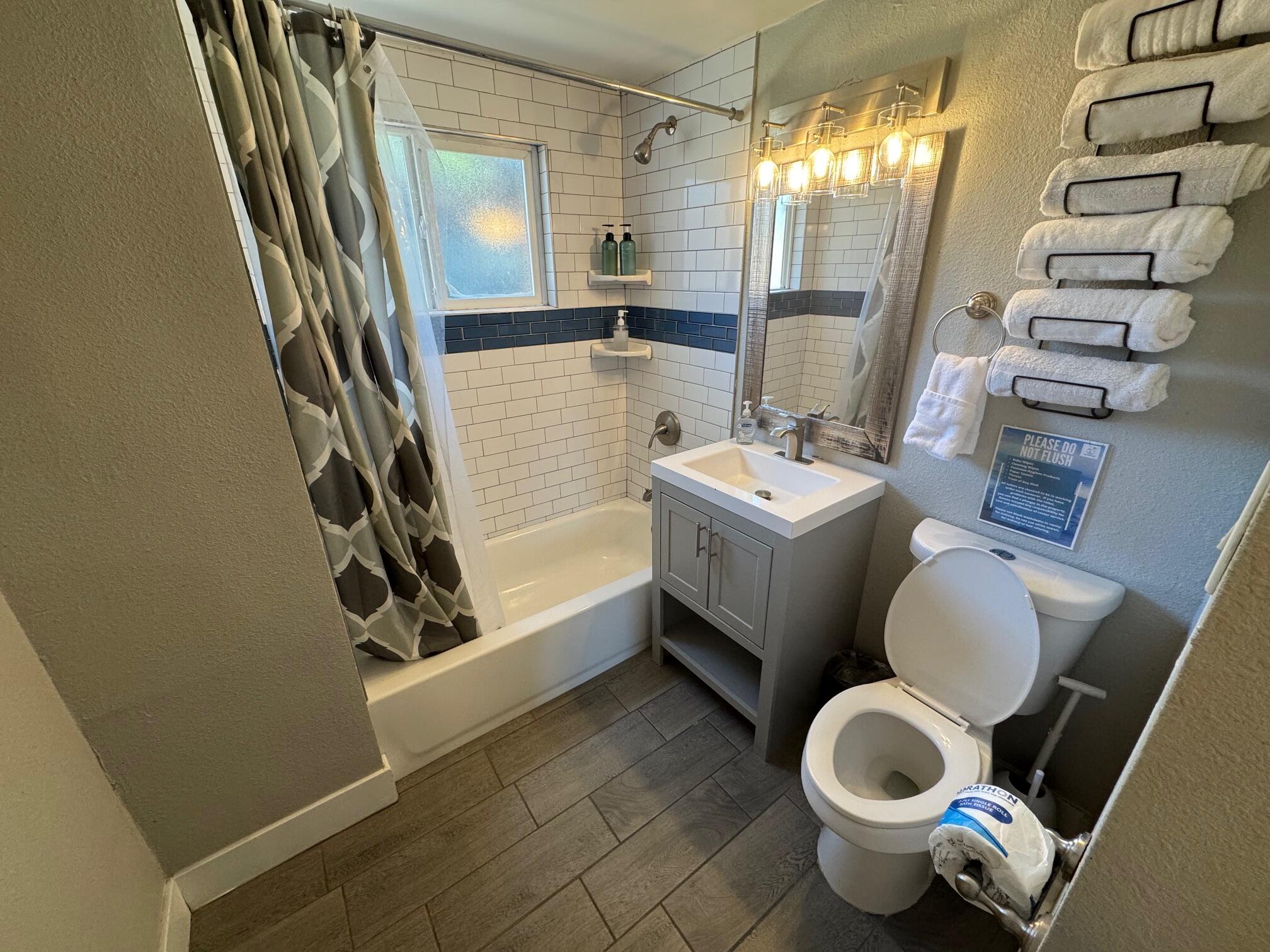 565 Denslowe Drive Reno, NV 89512 - Photo 5 of 26 a bathroom with a sink toilet and mirror