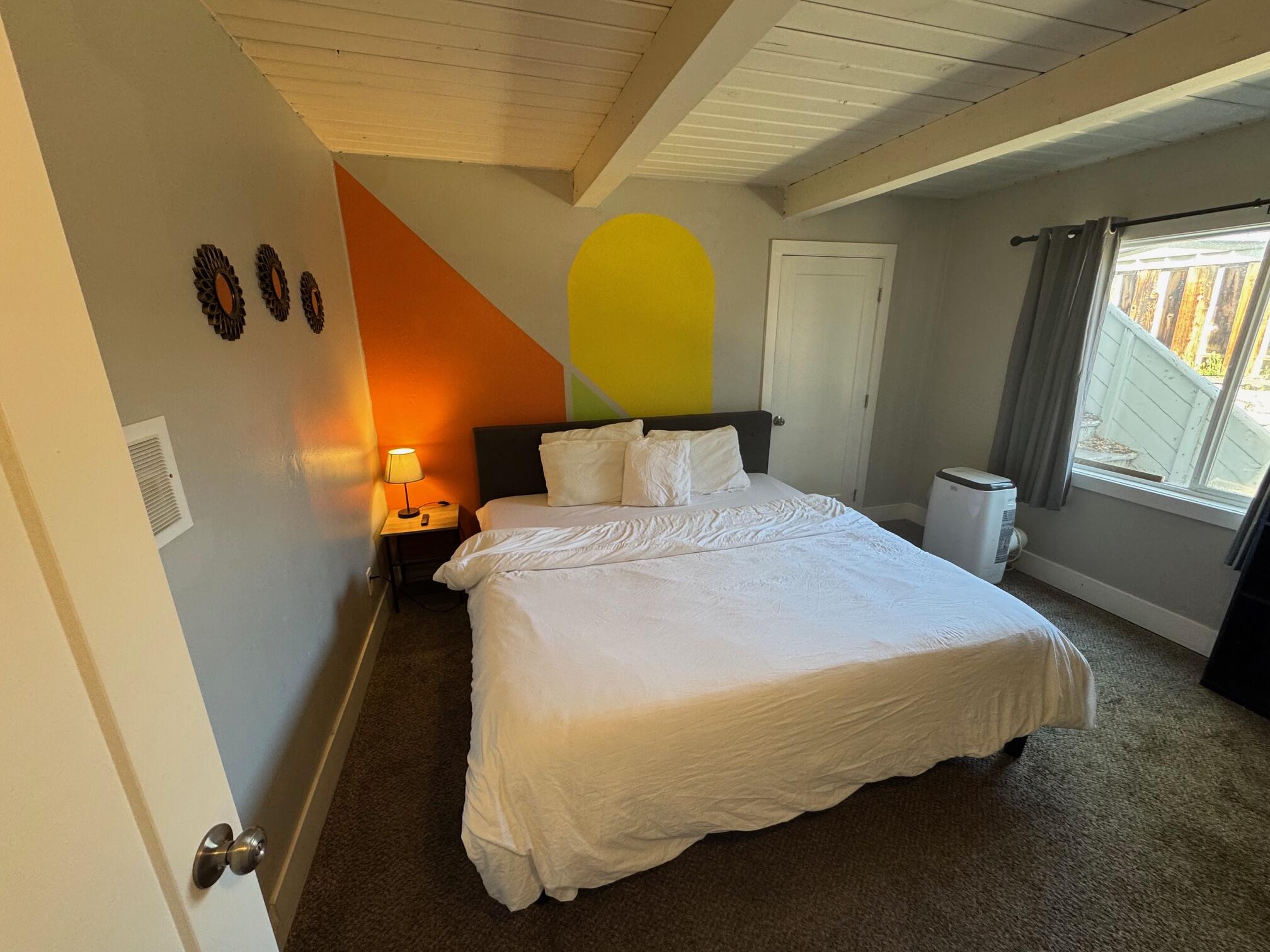 565 Denslowe Drive Reno, NV 89512 - Photo 6 of 26 a bedroom with a bed and wooden floor