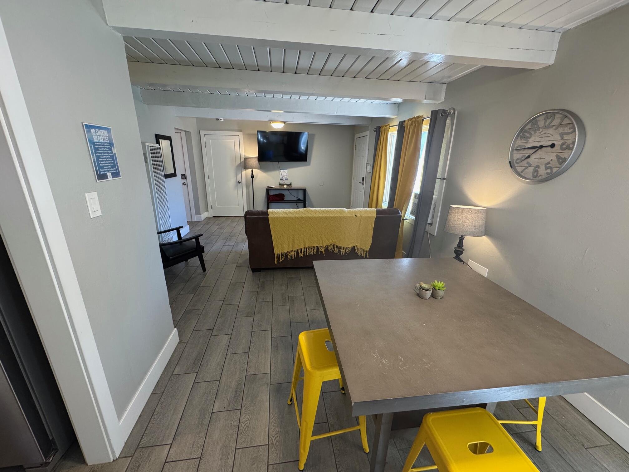 565 Denslowe Drive Reno, NV 89512 - Photo 8 of 26 a living room with furniture and a table