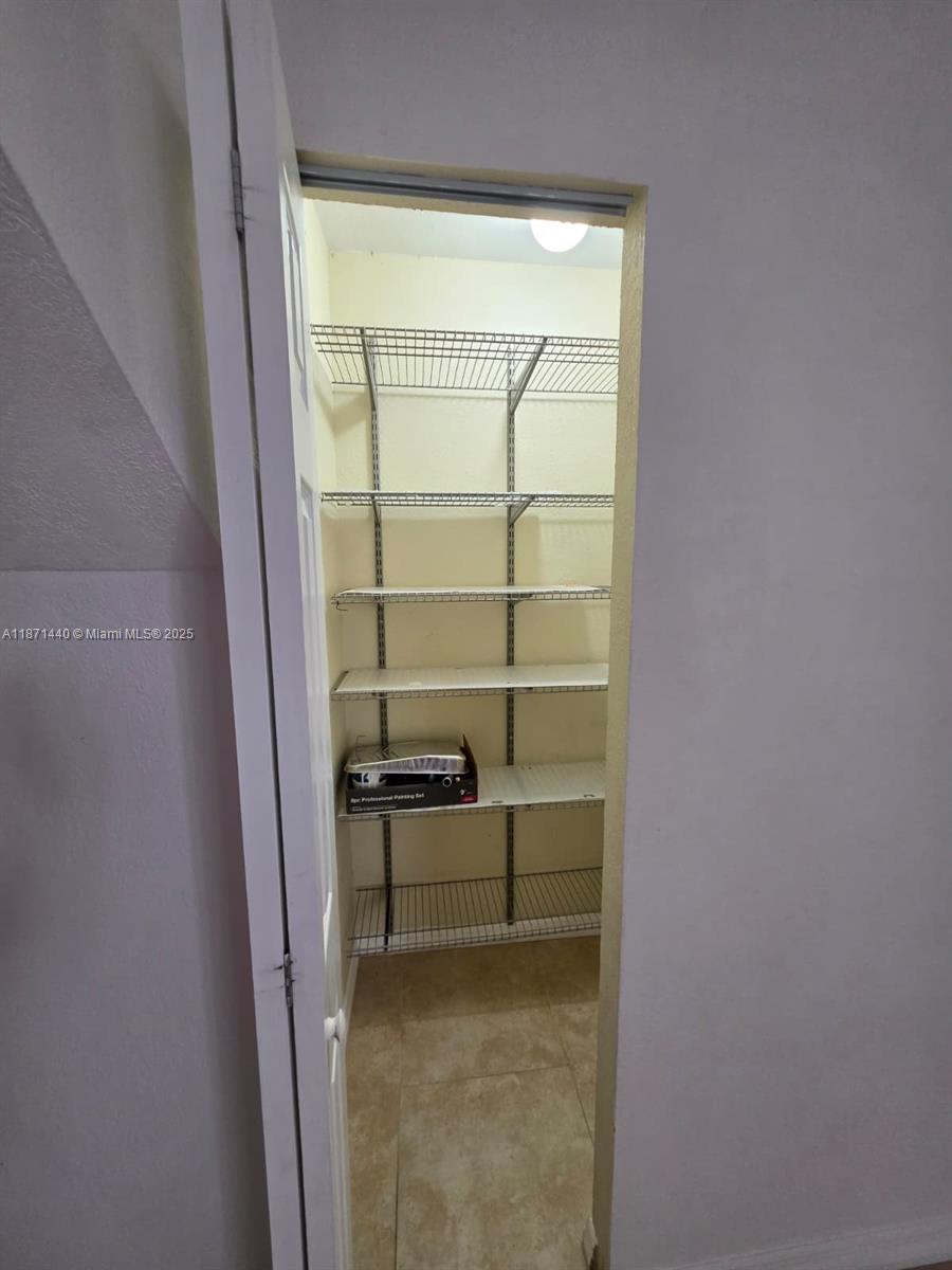 20200 West Country Club Drive, Unit 104 Aventura, FL 33180 - Photo 13 of 43 a view of a hallway