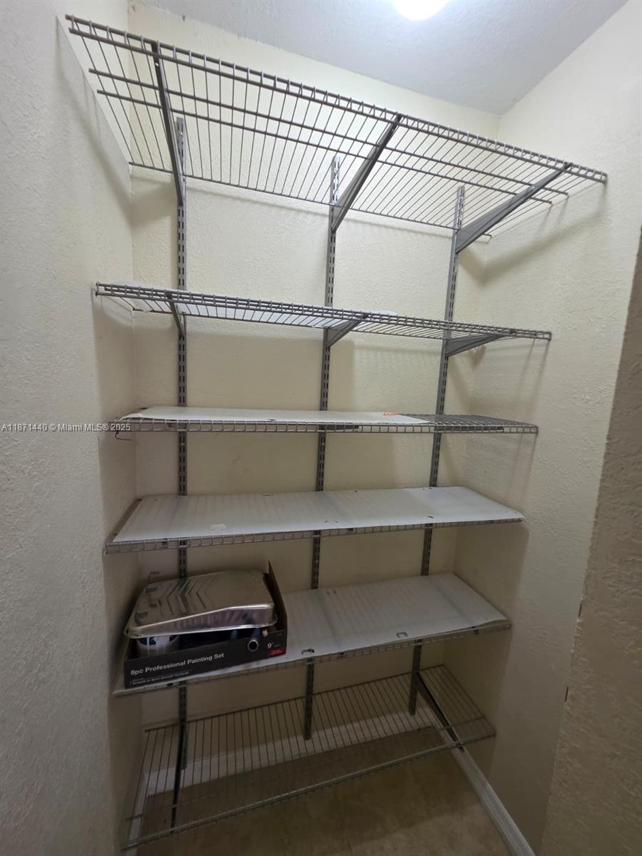 20200 West Country Club Drive, Unit 104 Aventura, FL 33180 - Photo 14 of 43 a view of storage and utility room