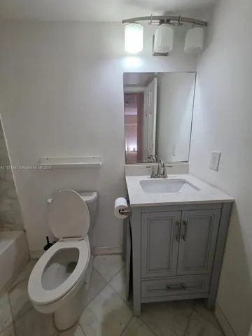 a bathroom with a toilet and a sink