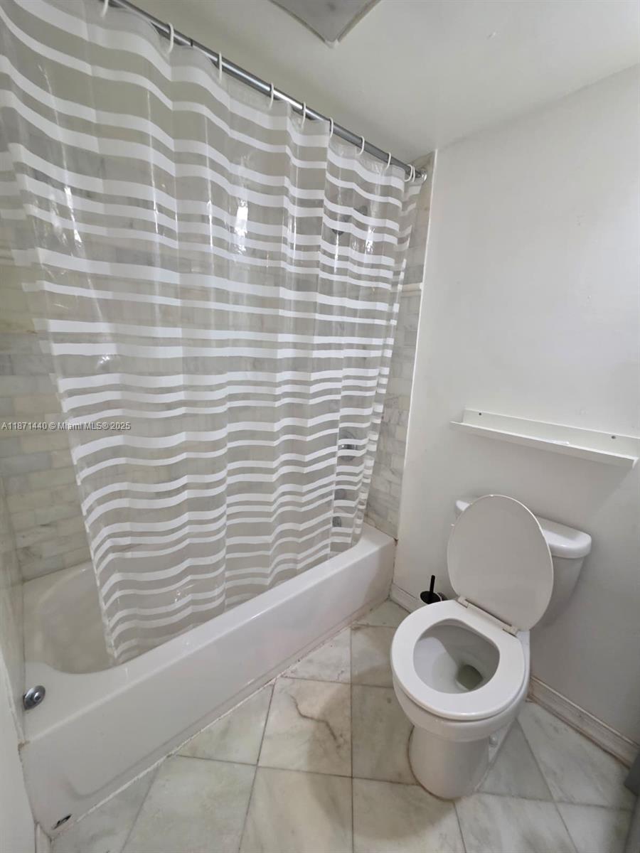 20200 West Country Club Drive, Unit 104 Aventura, FL 33180 - Photo 35 of 43 a bathroom with a toilet and a sink