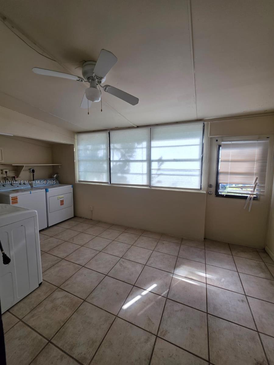 20200 West Country Club Drive, Unit 104 Aventura, FL 33180 - Photo 36 of 43 a view of kitchen with furniture and window