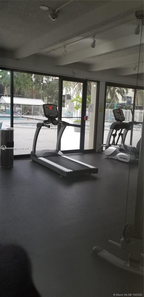 20200 West Country Club Drive, Unit 104 Aventura, FL 33180 - Photo 43 of 43 a view of a room with gym equipment