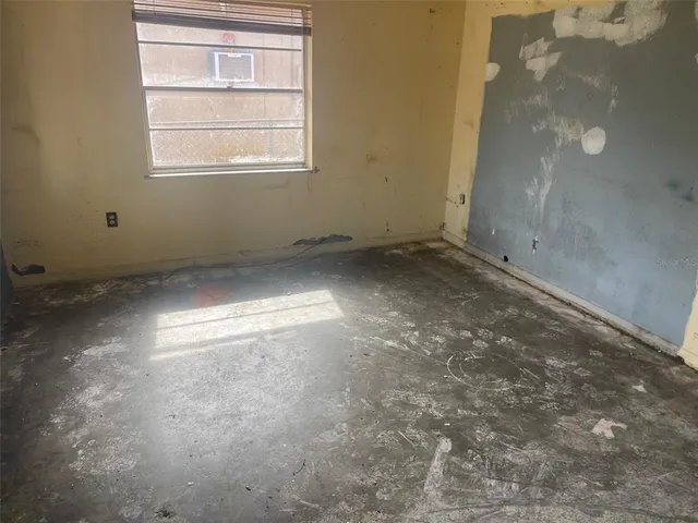 an empty room with windows