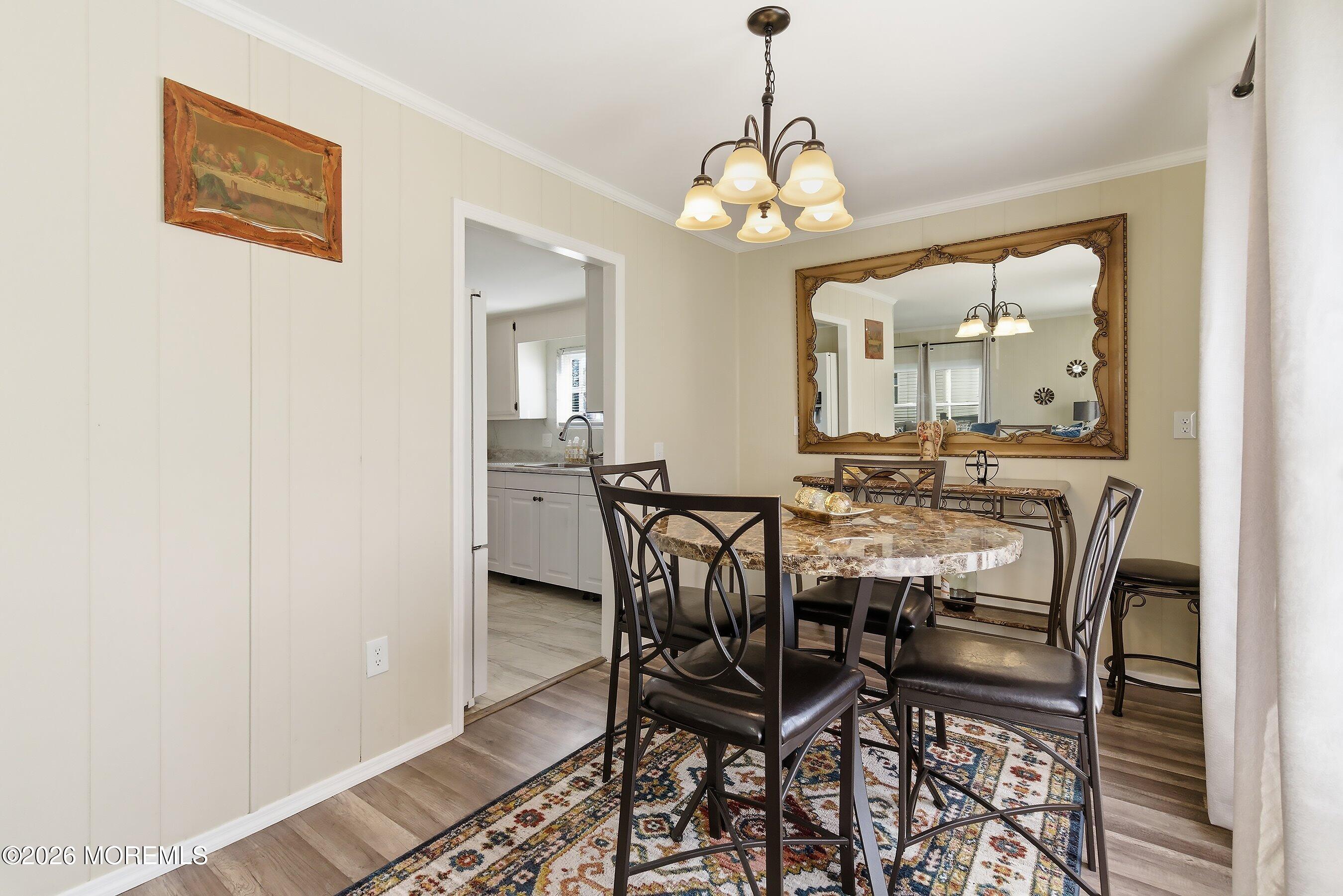 164 Camino Rio Toms River, NJ 08755 - Photo 11 of 36 a view of a dining room with furniture and a chandelier