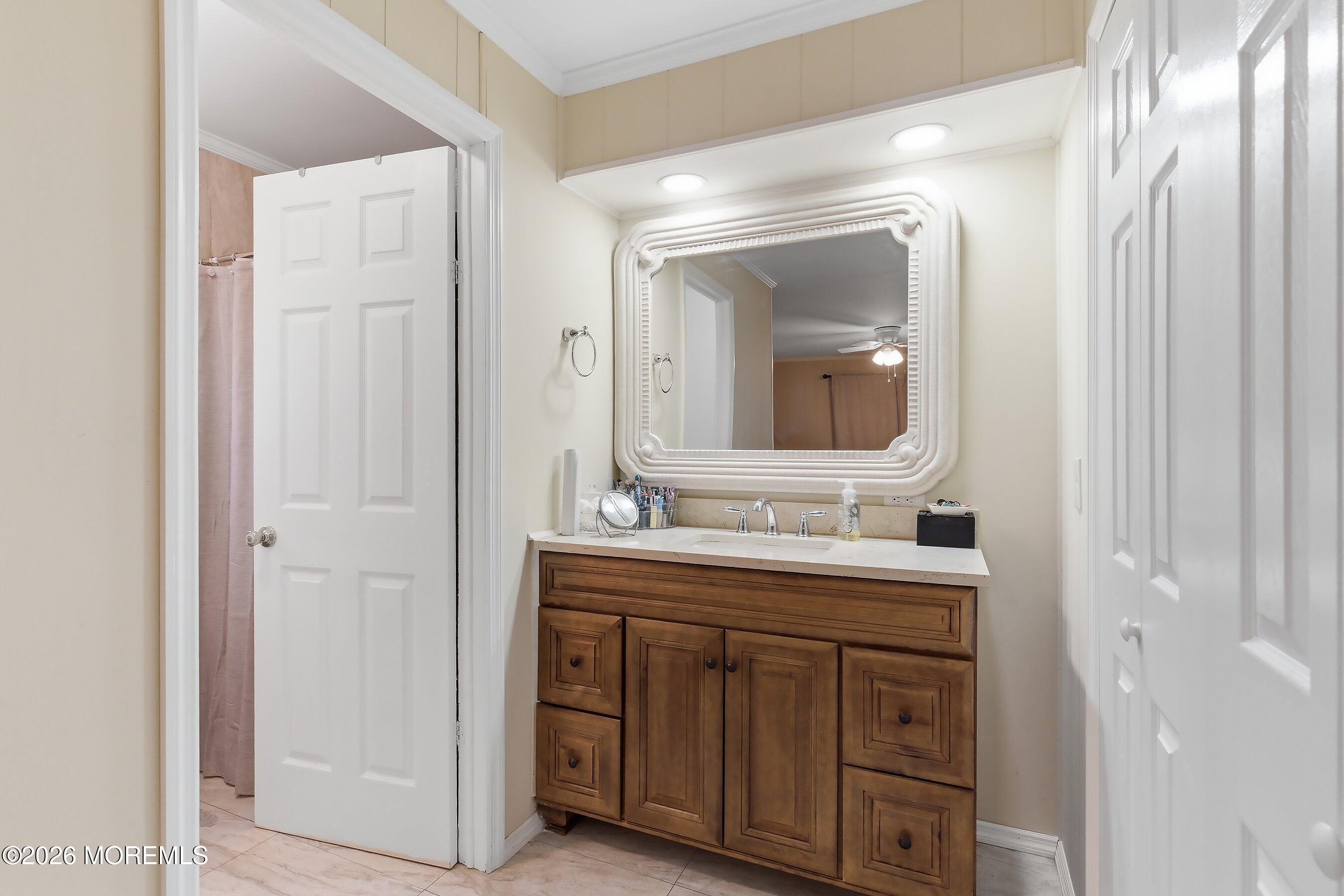 164 Camino Rio Toms River, NJ 08755 - Photo 18 of 36 a bathroom with a double vanity sink and a mirror