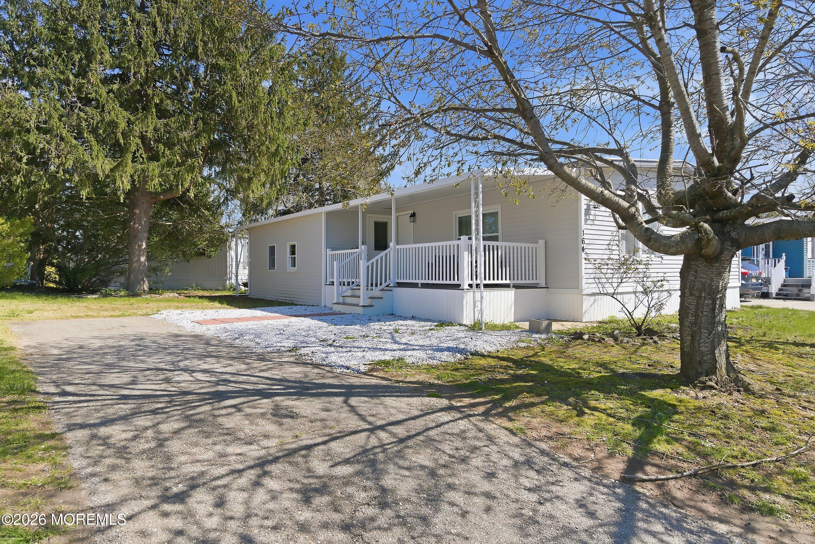 164 Camino Rio Toms River, NJ 08755 - Photo 2 of 36 a house view with a yard in front of it