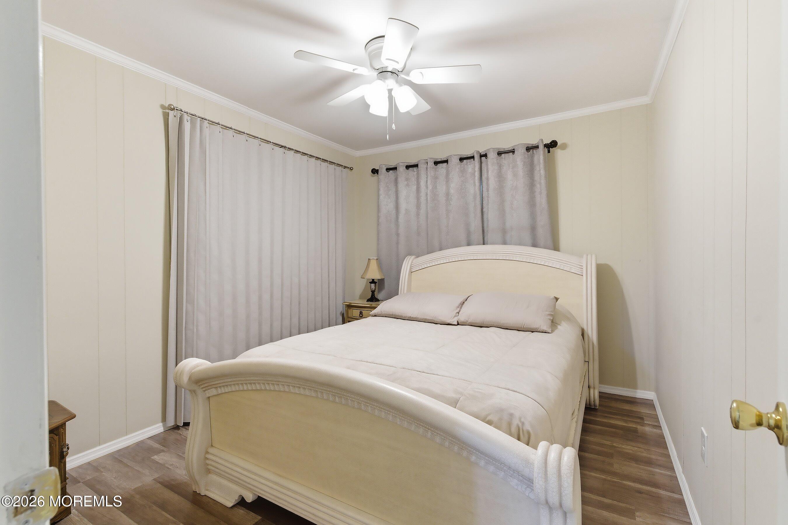 164 Camino Rio Toms River, NJ 08755 - Photo 21 of 36 a bedroom with a bed and a ceiling fan