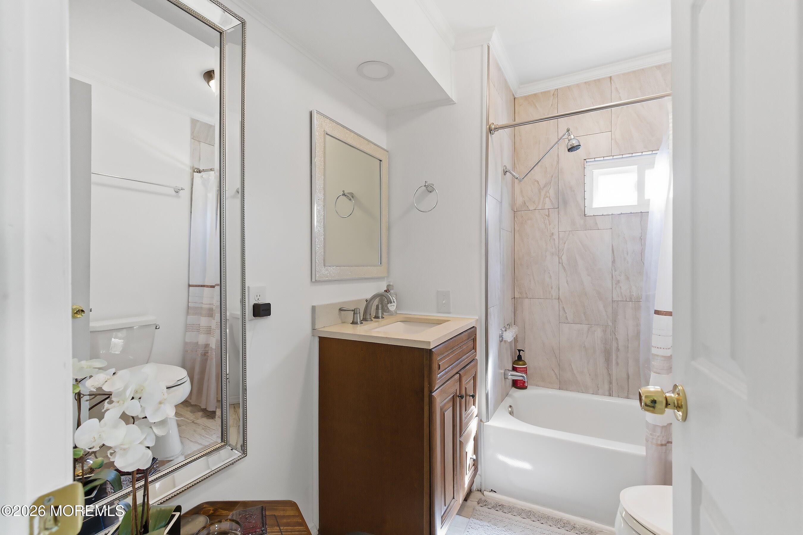 164 Camino Rio Toms River, NJ 08755 - Photo 22 of 36 a bathroom with a tub sink toilet and a mirror
