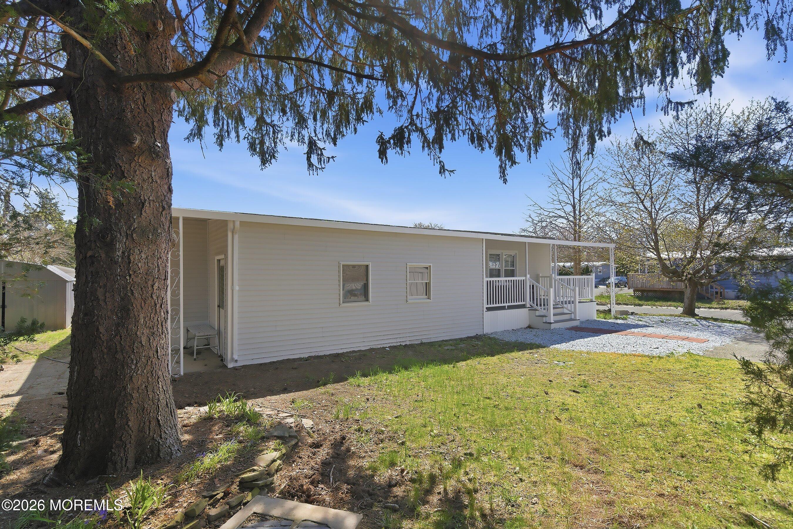 164 Camino Rio Toms River, NJ 08755 - Photo 26 of 36 a view of a house with a yard