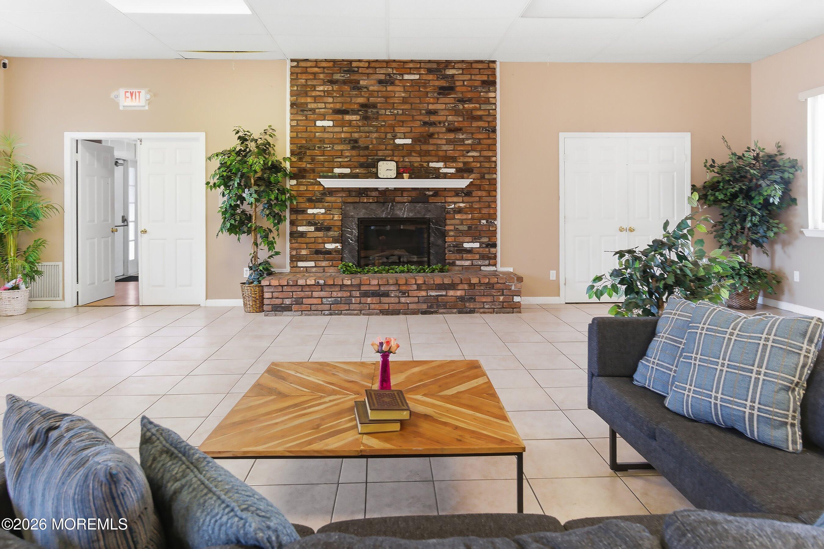164 Camino Rio Toms River, NJ 08755 - Photo 33 of 36 a living room with furniture and a fireplace