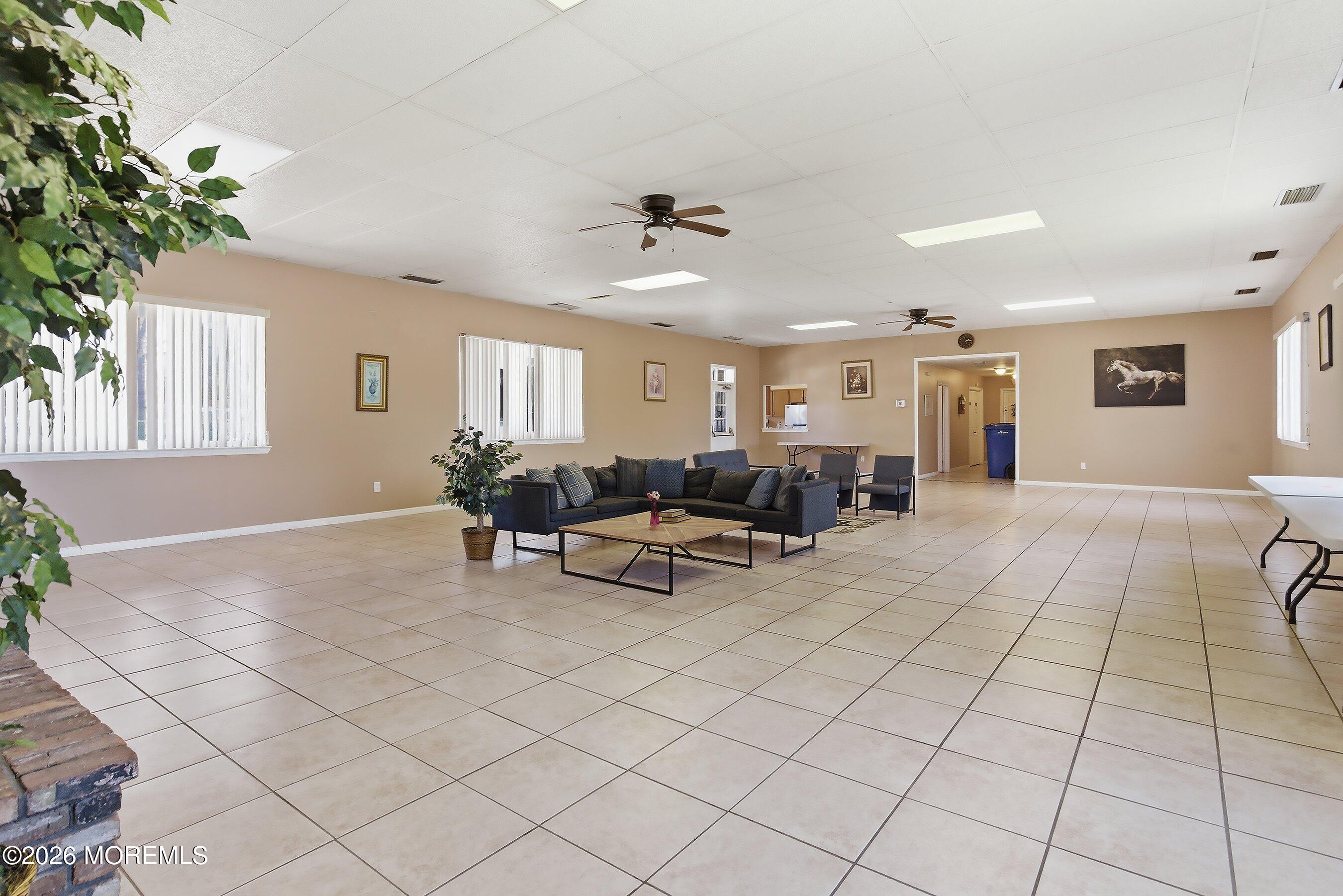 164 Camino Rio Toms River, NJ 08755 - Photo 34 of 36 a living room with furniture and a potted plant