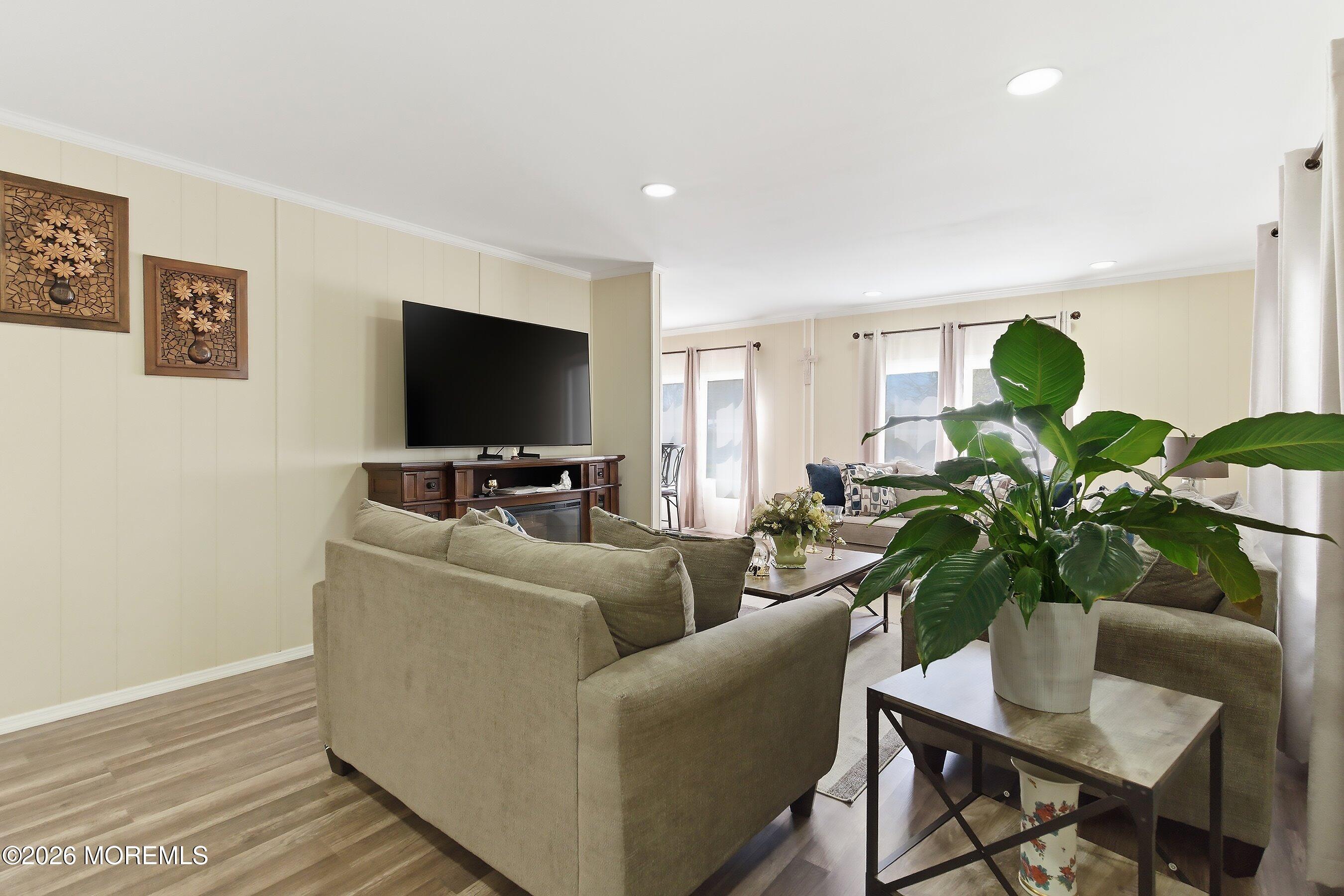 164 Camino Rio Toms River, NJ 08755 - Photo 6 of 36 a living room with furniture and a flat screen tv