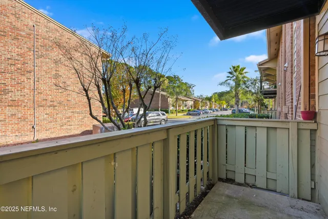 a view of balcony with a potted plant