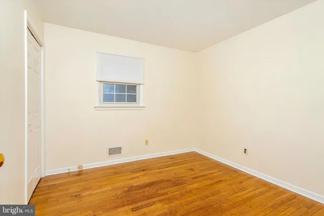 a room with a bed and a window