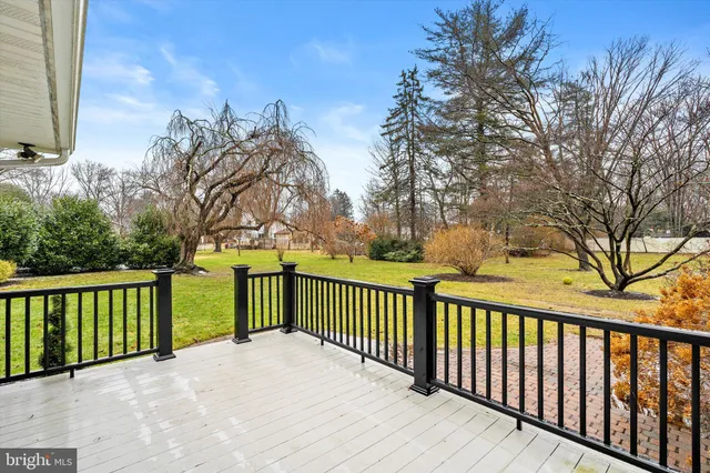 a view of a balcony with wooden fence