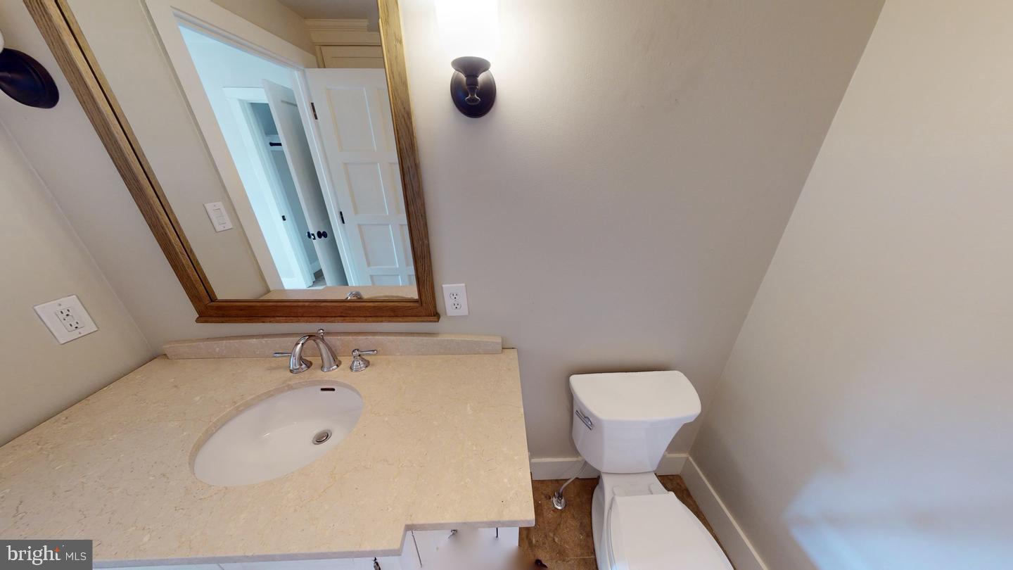 6 South Valley Road, Unit D Paoli, PA 19301 - Photo 2 of 7 a bathroom with a sink and a mirror