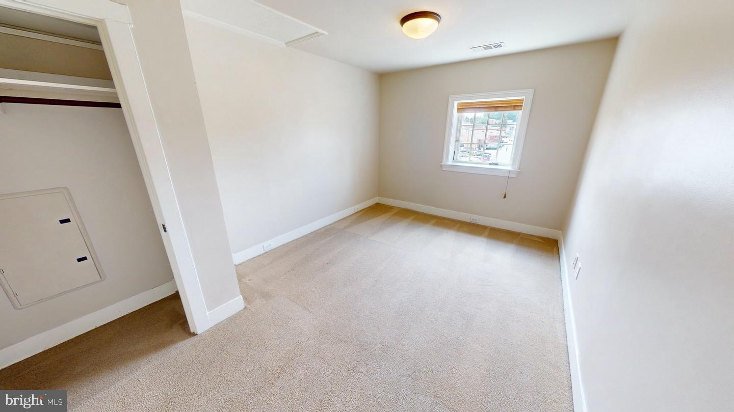 6 South Valley Road, Unit D Paoli, PA 19301 - Photo 4 of 7 an empty room with windows