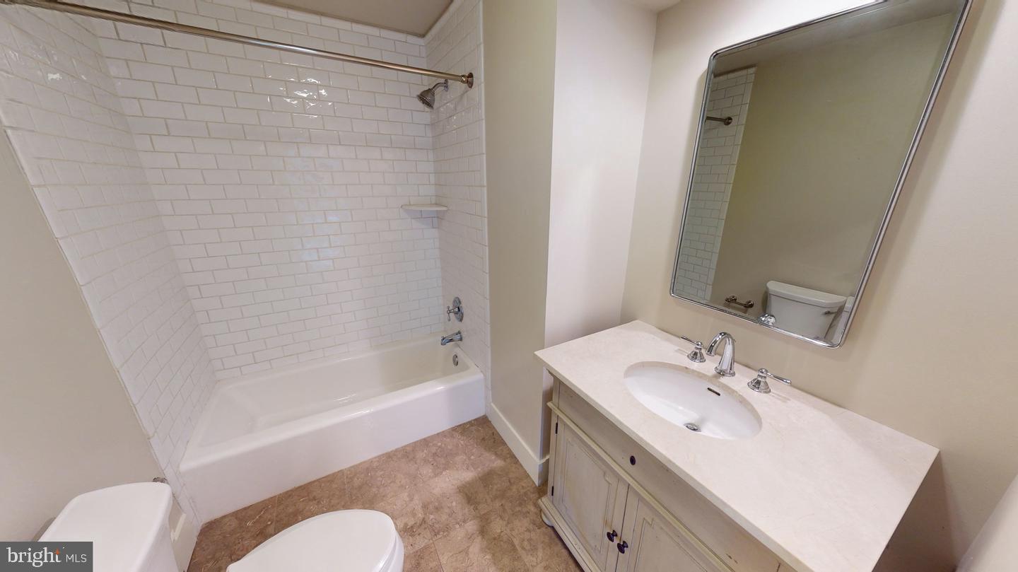 6 South Valley Road, Unit D Paoli, PA 19301 - Photo 6 of 7 a bathroom with a sink toilet and shower