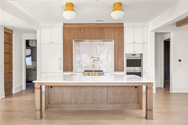 a bathroom with a sink a mirror and a window