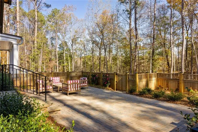 a outdoor space with patio the couches and a dining table with garden view