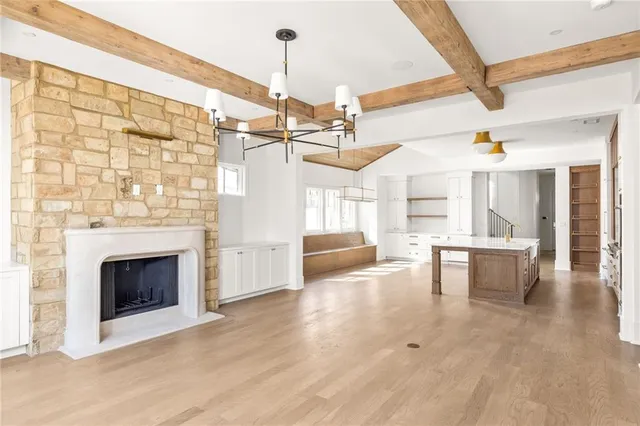 a view of a livingroom with furniture and a fireplace
