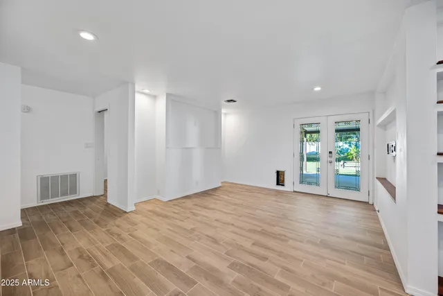 a view of a big room with windows and cabinet