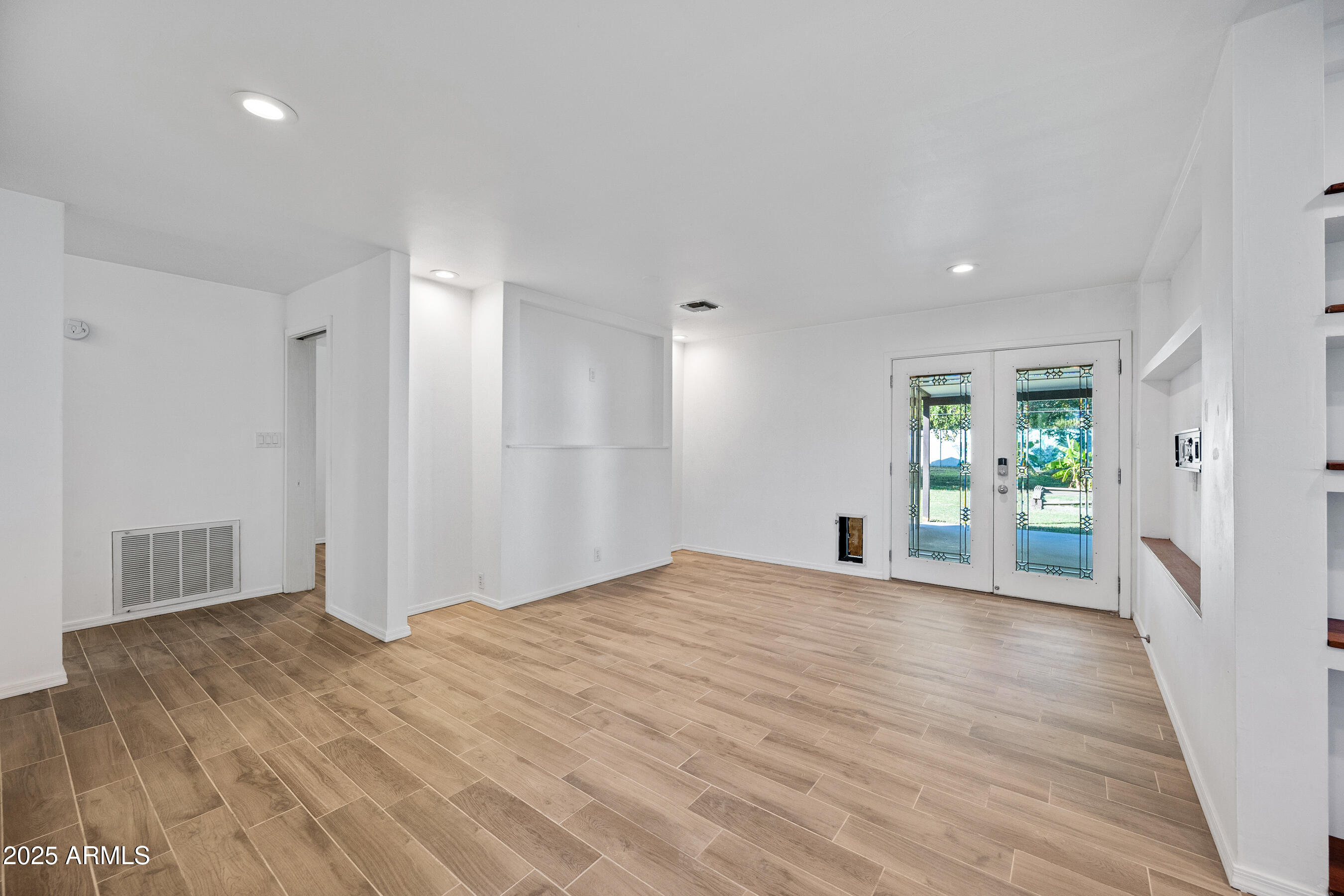 1014 East Orange Drive Phoenix, AZ 85014 - Photo 3 of 20 a view of a big room with windows and cabinet