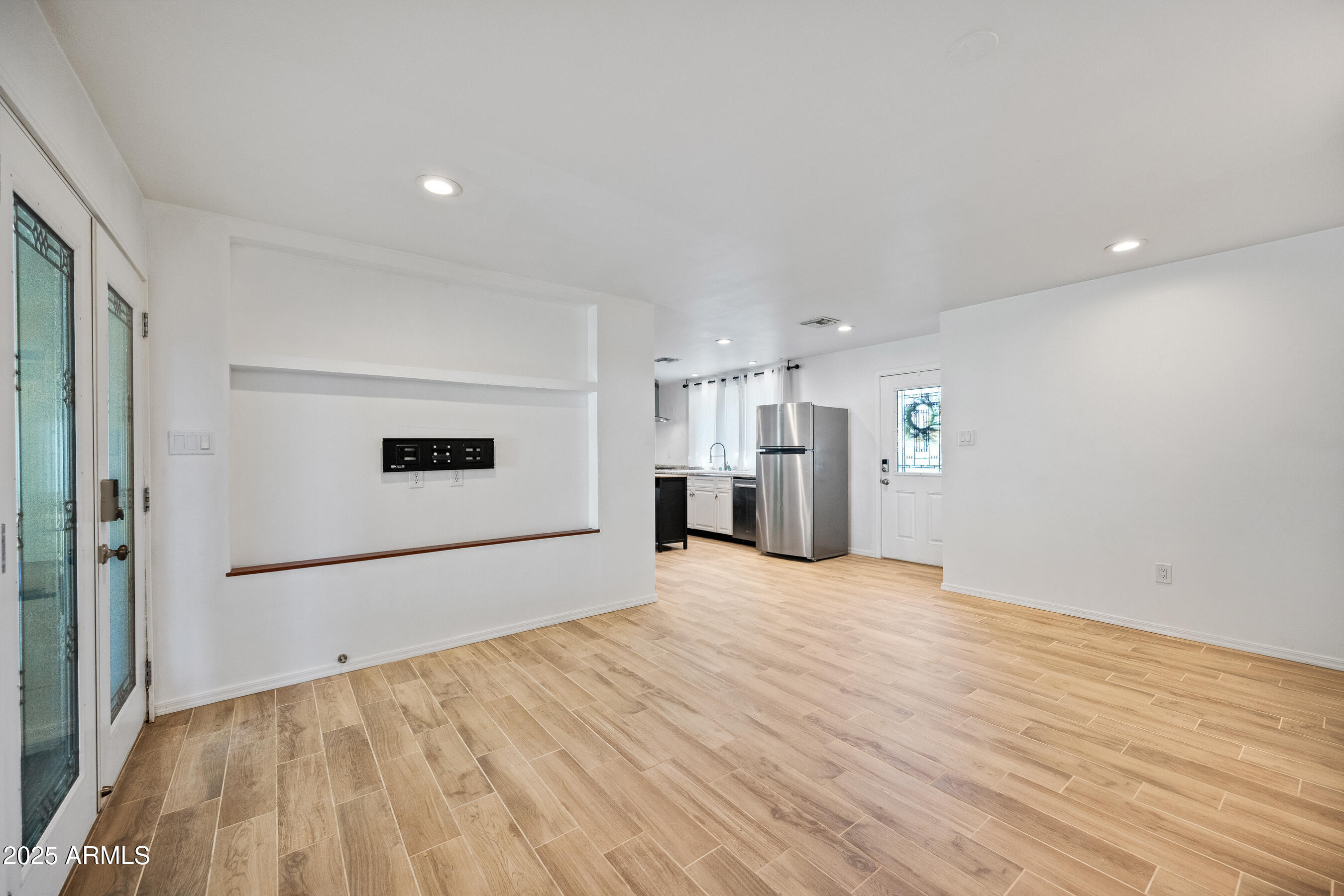 1014 East Orange Drive Phoenix, AZ 85014 - Photo 5 of 20 a view of empty room with wooden floor