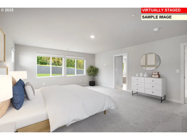 a bedroom with a bed a mirror and window