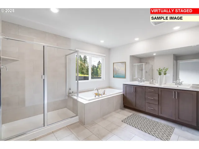 a spacious bathroom with a tub sink shower and mirror