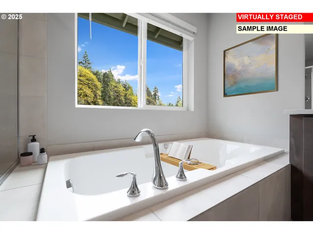 a bathroom with a tub sink and mirror